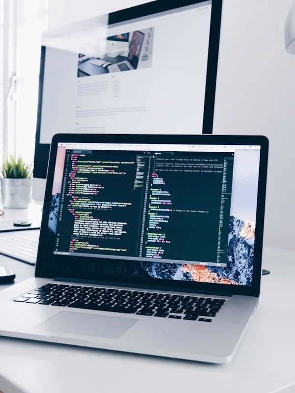 Developer coding on a laptop